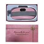 Pink vibrating waist relaxation belt with digital display, shown in gift packaging box with grey adjustable strap and ‘Especially for you’ printed cover