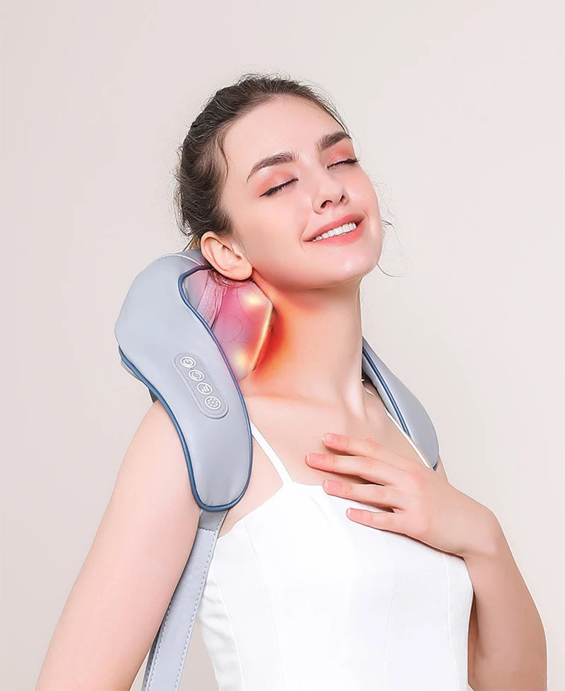 Woman enjoying electric shoulder and neck massager with heat therapy, showing targeted relief on neck muscles for relaxation and pain reduction