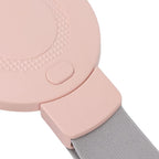 Close-up of pink vibrating waist relaxation belt with textured edge design, power button, and grey adjustable strap for secure fit
