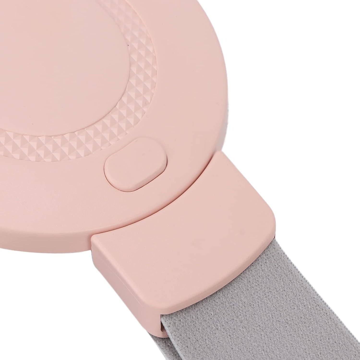 Close-up of pink vibrating waist relaxation belt with textured edge design, power button, and grey adjustable strap for secure fit