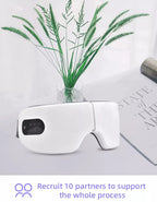 White smart electric eye massager with digital control panel placed on table, designed for heat, vibration, and air pressure massage to relieve eye strain and fatigue